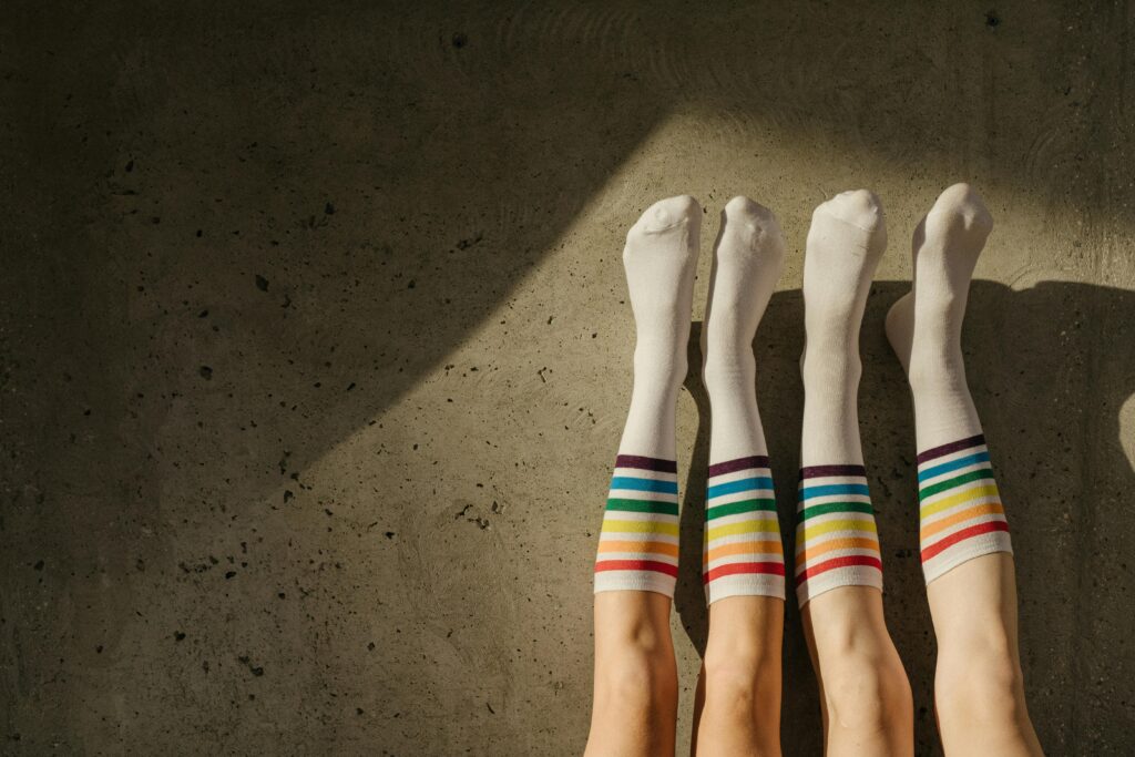 A Couple Wearing Rainbow Socks