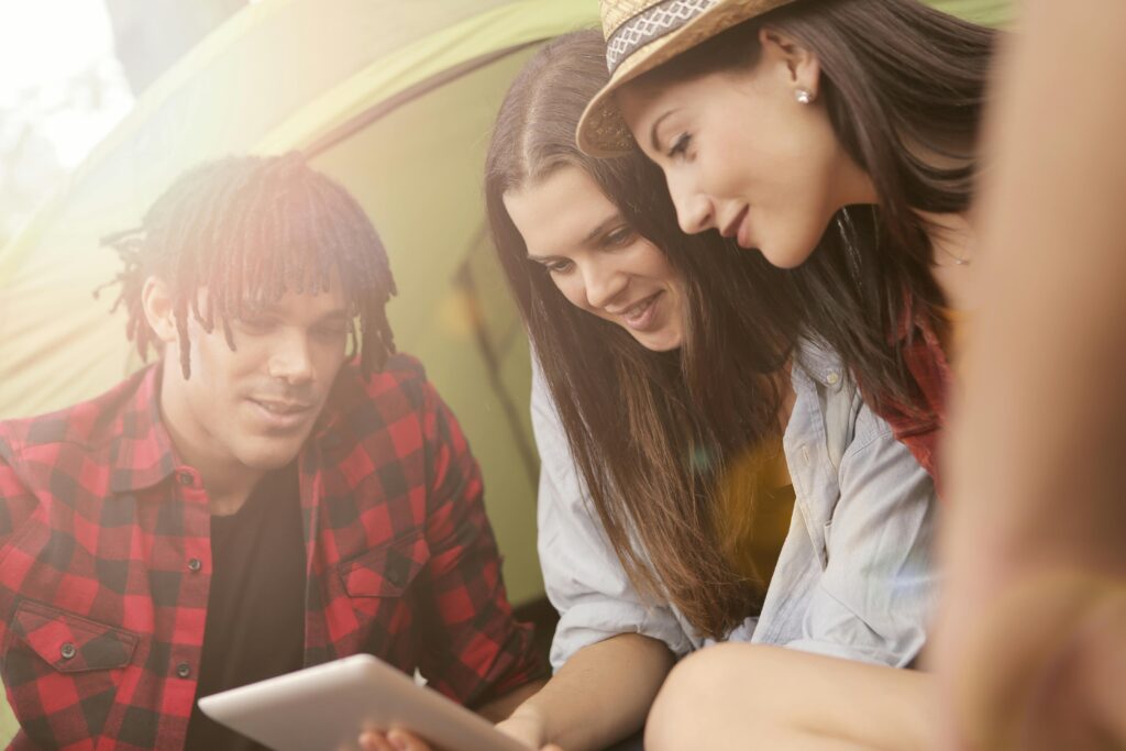 Woman in Denim Long sleeves Holding Tablet
