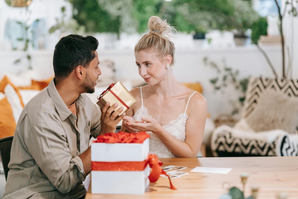 Man and Woman Sitting at Table
