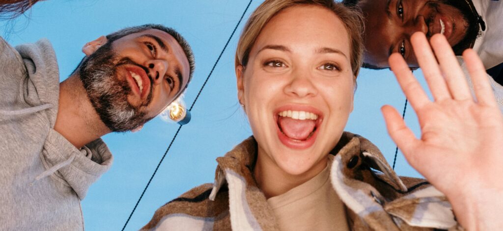 Non-monogamous couples smiling for camera