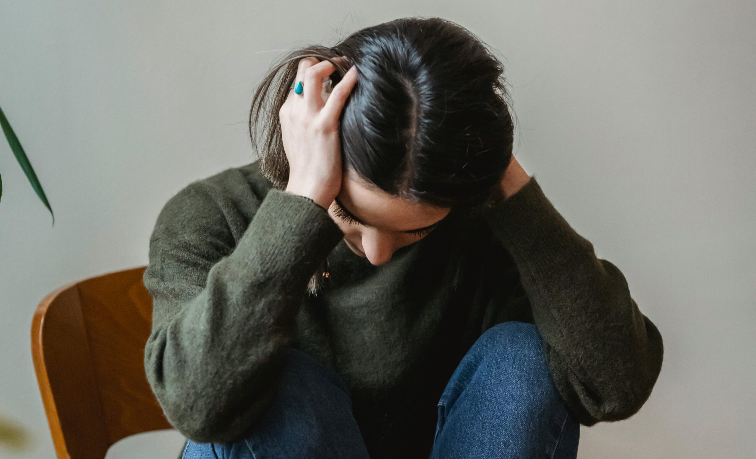 Jealous woman sitting in chair
