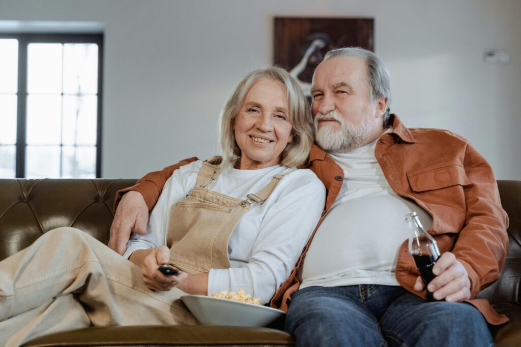 Man and Woman Sitting on Couch
