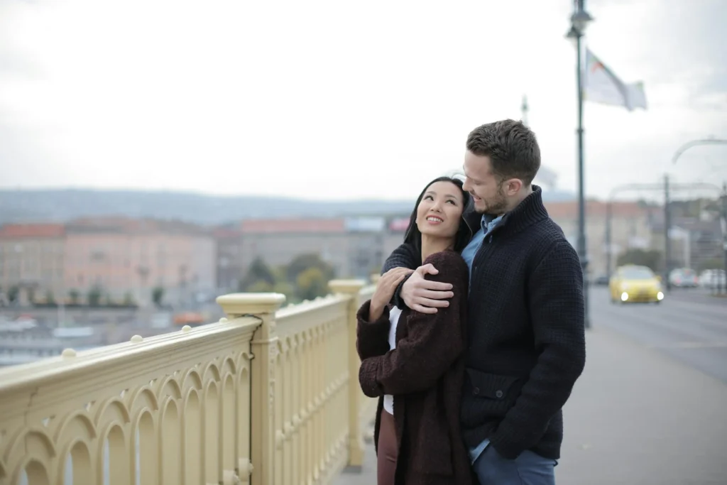 Dating Couple Standing on the Bridge