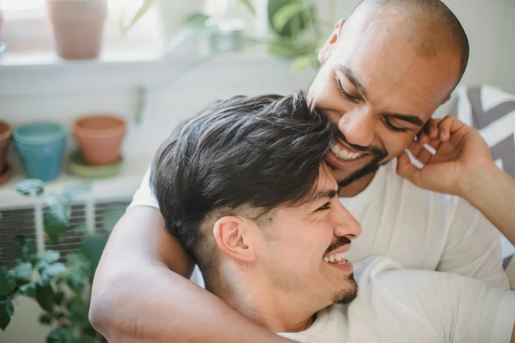Smiling Men Embracing with Affection