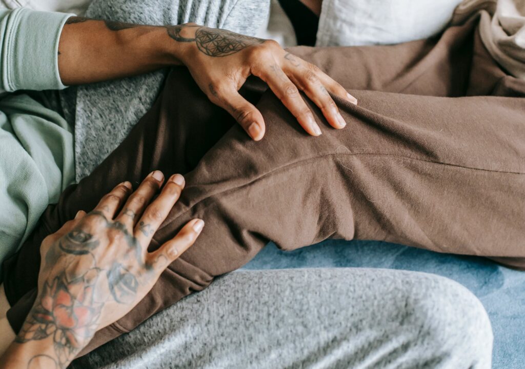 Couple cuddling on couch