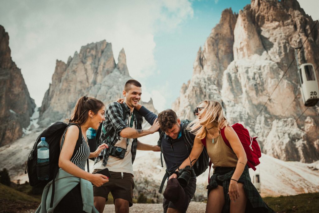 low angle photography of two men playing beside two women