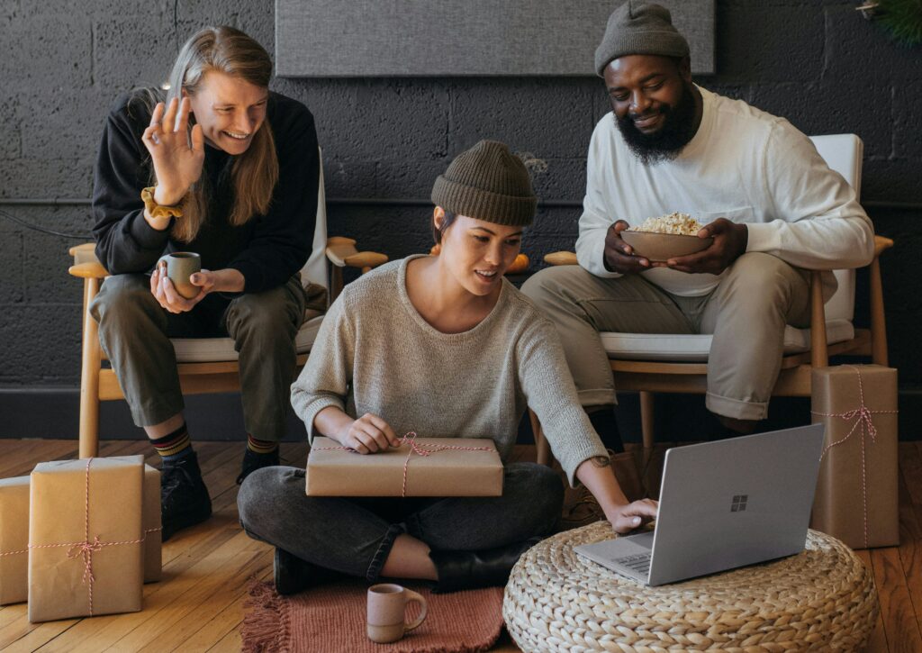 three polyamorous friends on laptop
