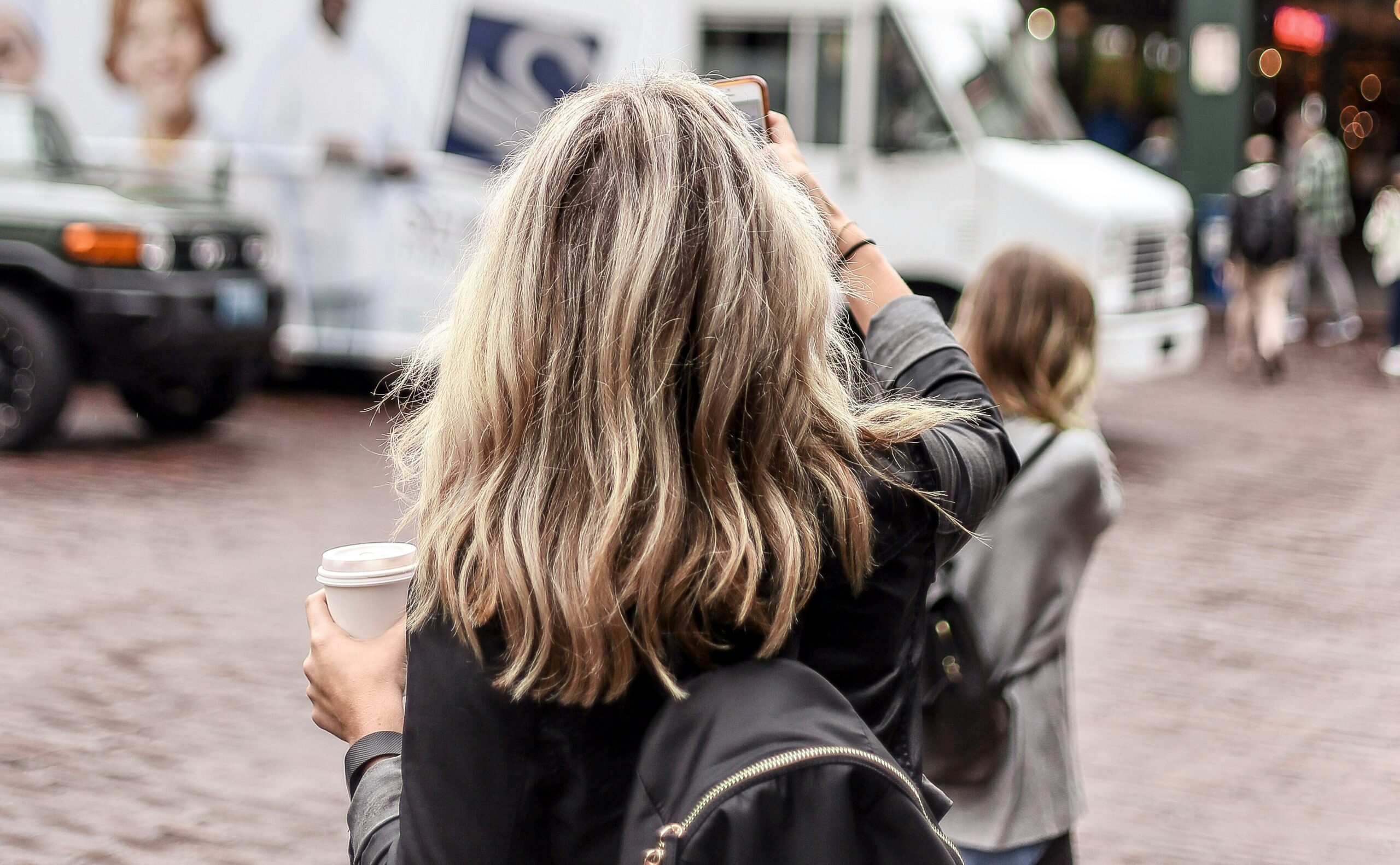 woman standing in front of public market center in Seattle