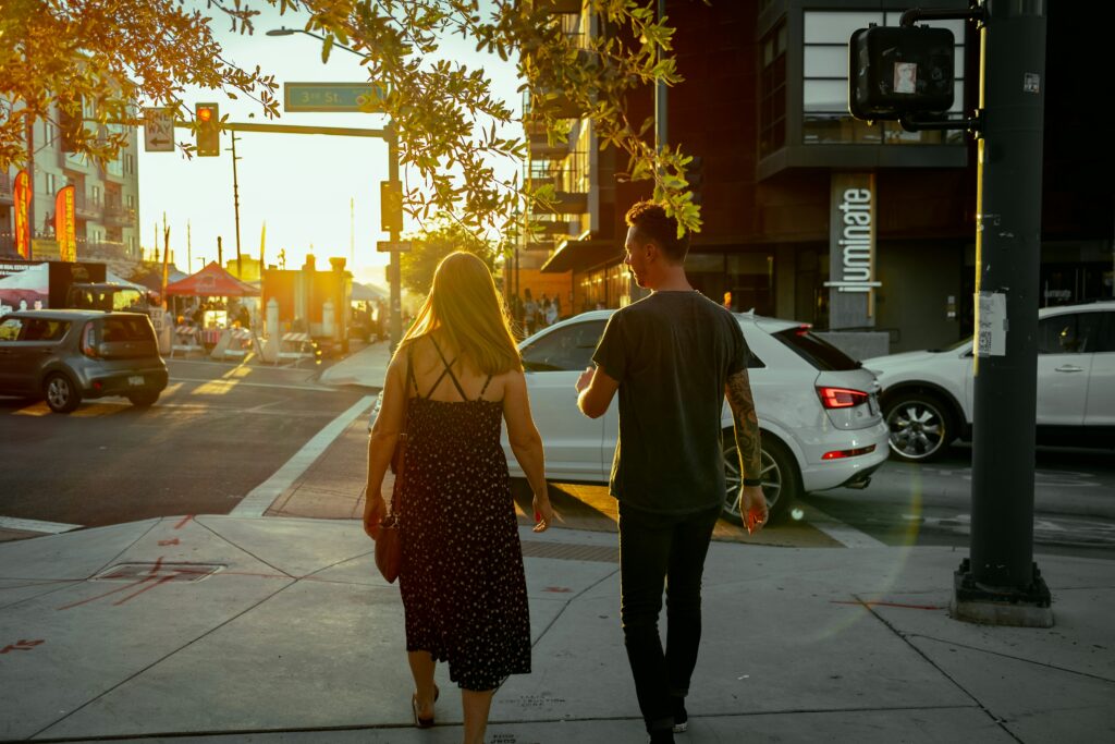 a man and a woman walking down a street