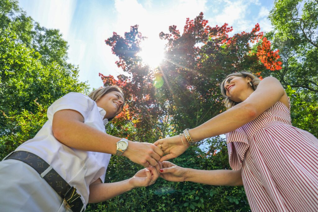 two women holding hands