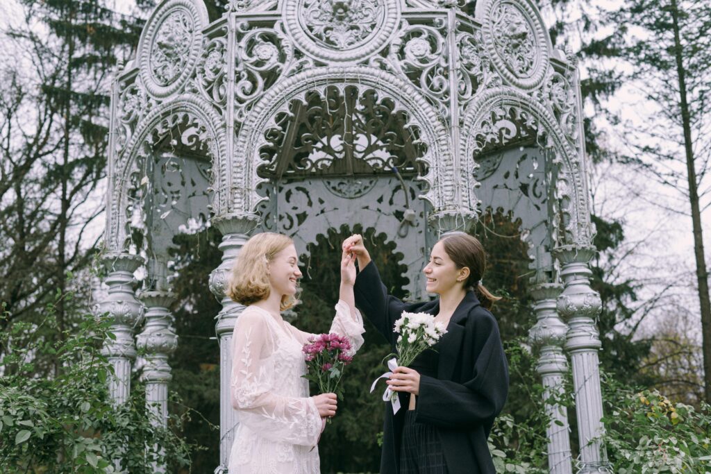 A Couple Holding Bouquet of Flowers
