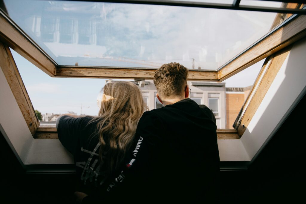 Couple looking out window