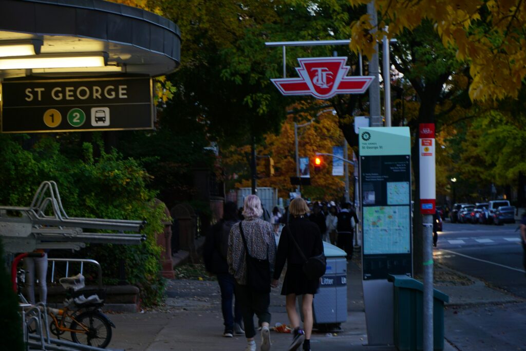 A couple walking past St George subway station